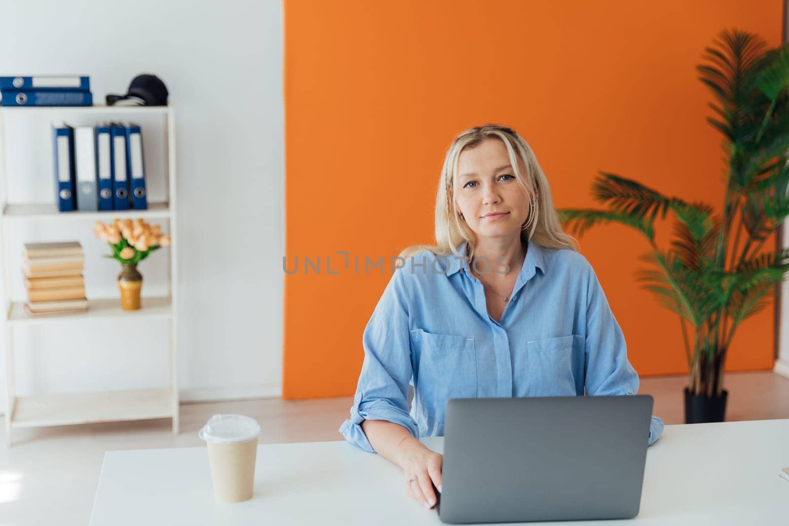 Business Woman Blonde With Laptop Small Business Online by Simakov