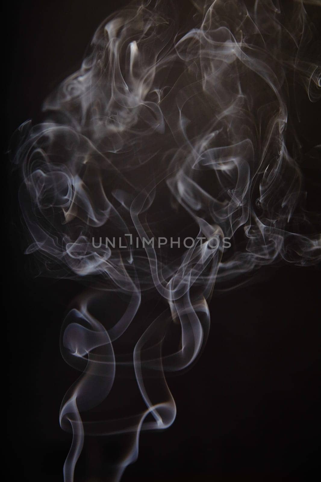 Ethereal Smoke Dance Against Dark Background by njproductions