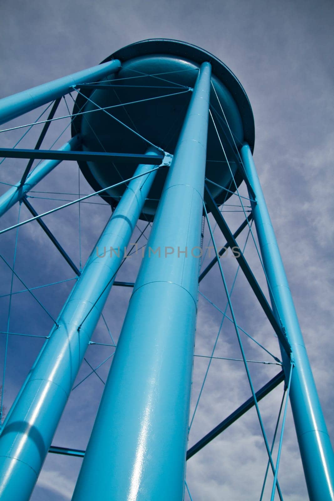 Low Angle View of Blue Water Tower Against Cloudy Sky in Allegan, Michigan by njproductions