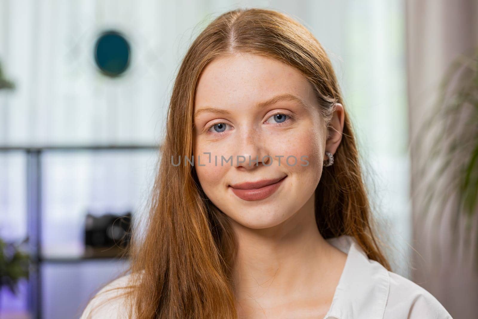 Portrait of happy calm teenager girl at home couch smiling friendly, glad expression looking away dreaming resting, relaxation feel satisfied concept good news celebrate win. Child on living room sofa