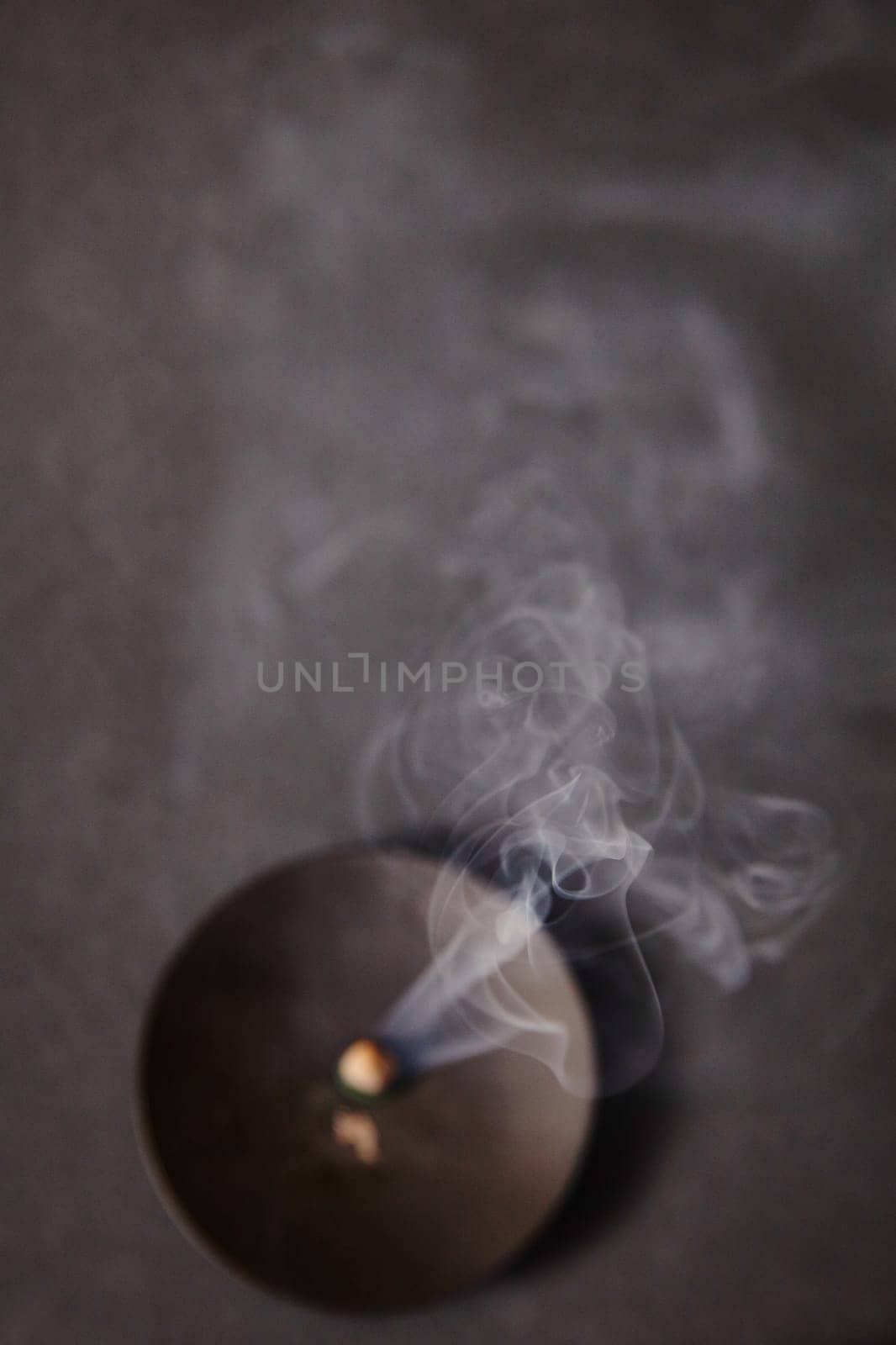 Incense from Above with Rising Smoke in Subdued Indoor Lighting by njproductions
