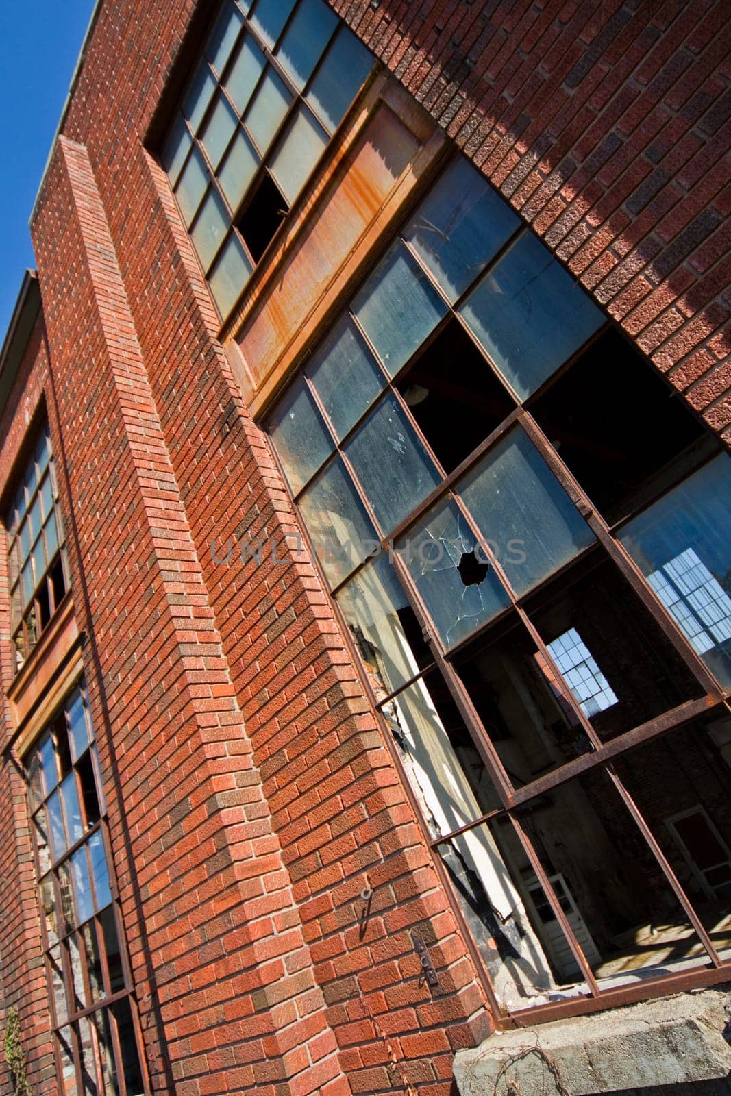 Sunlit Decay of Auburn Electric Station, Indiana - Abandoned Red Brick Architecture with Broken Windows by njproductions