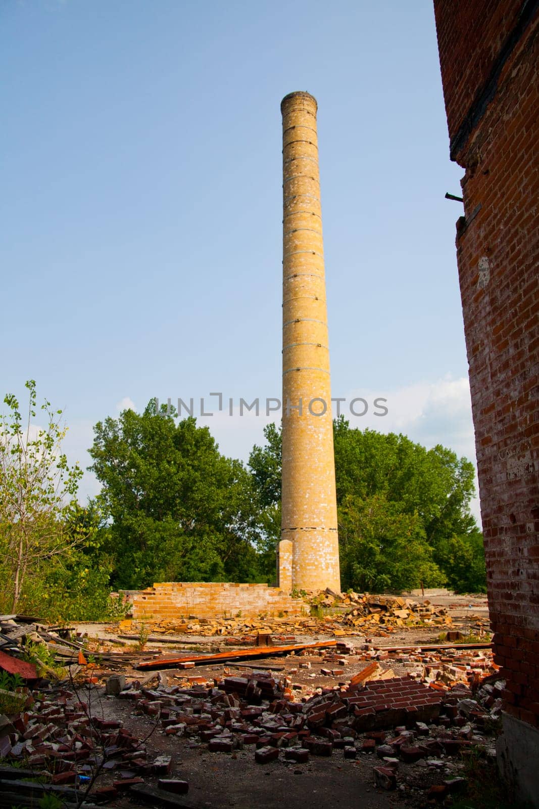 Decaying Industrial Chimney and Ruins Reclaimed by Nature in Pierceton, Indiana by njproductions