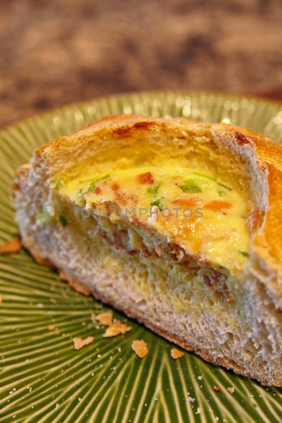 Freshly Baked Quiche Slice on Green Plate Close-Up by njproductions