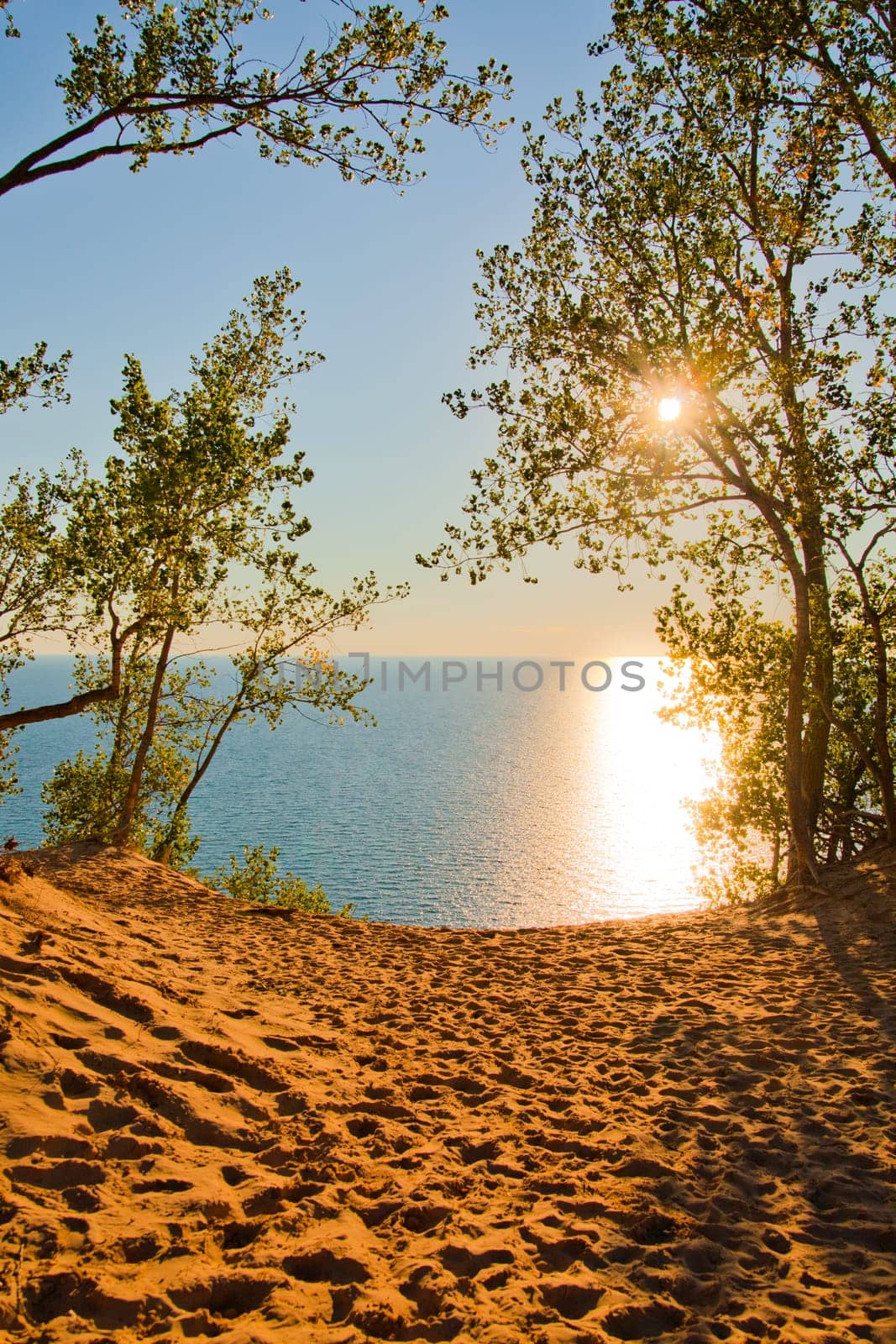 Golden Hour Serenity at Michigan Sand Dunes Overlooking Tranquil Waters by njproductions