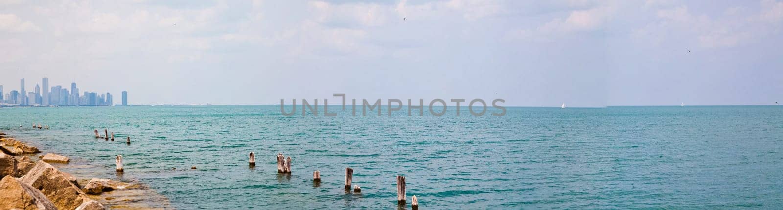 Tranquil Waterscape: Serene lake panorama with Chicago skyline as a majestic backdrop, capturing the peaceful harmony of urban nature in Illinois