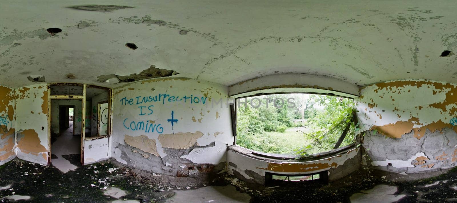 Explore the haunting beauty of an abandoned TB hospital in Lima, Ohio. Capture the eerie decay, graffiti messages, and nature's encroachment in this panoramic view.