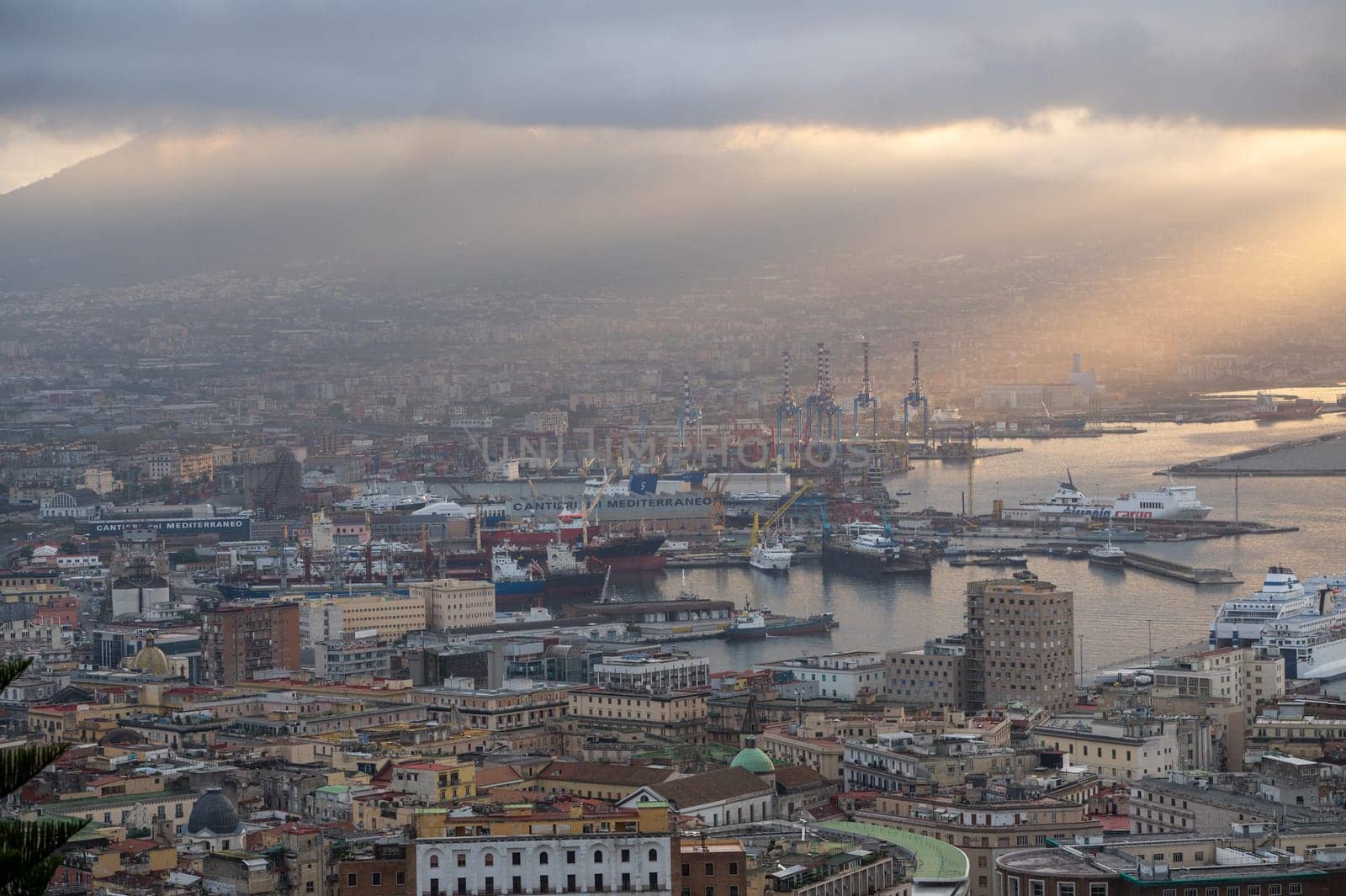 Panorama of the sea port of the city of Napoli in the morning with Vesuvius in the background.