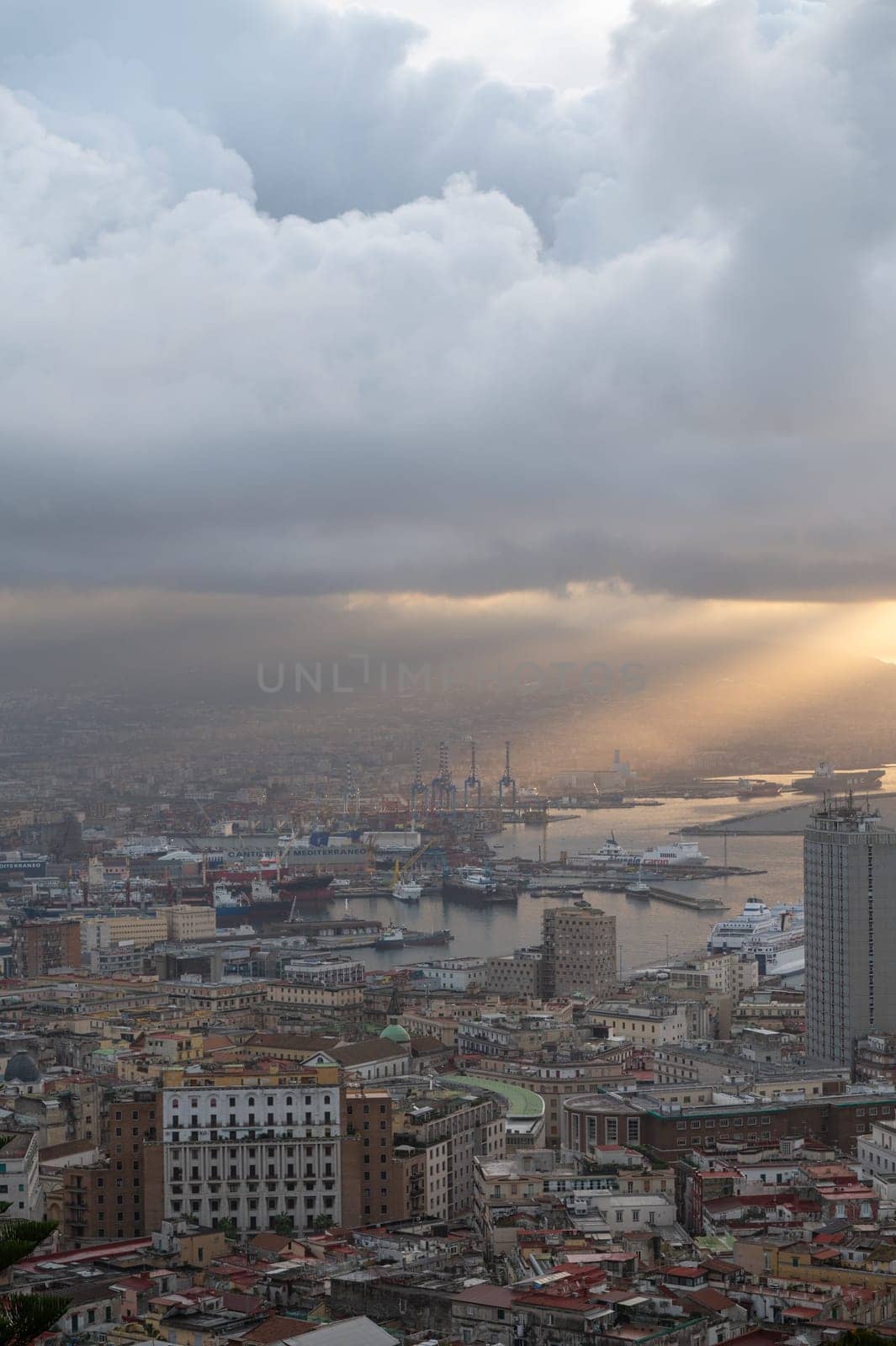 Panorama of the sea port of the city of Napoli in the morning with Vesuvius in the background by martinscphoto