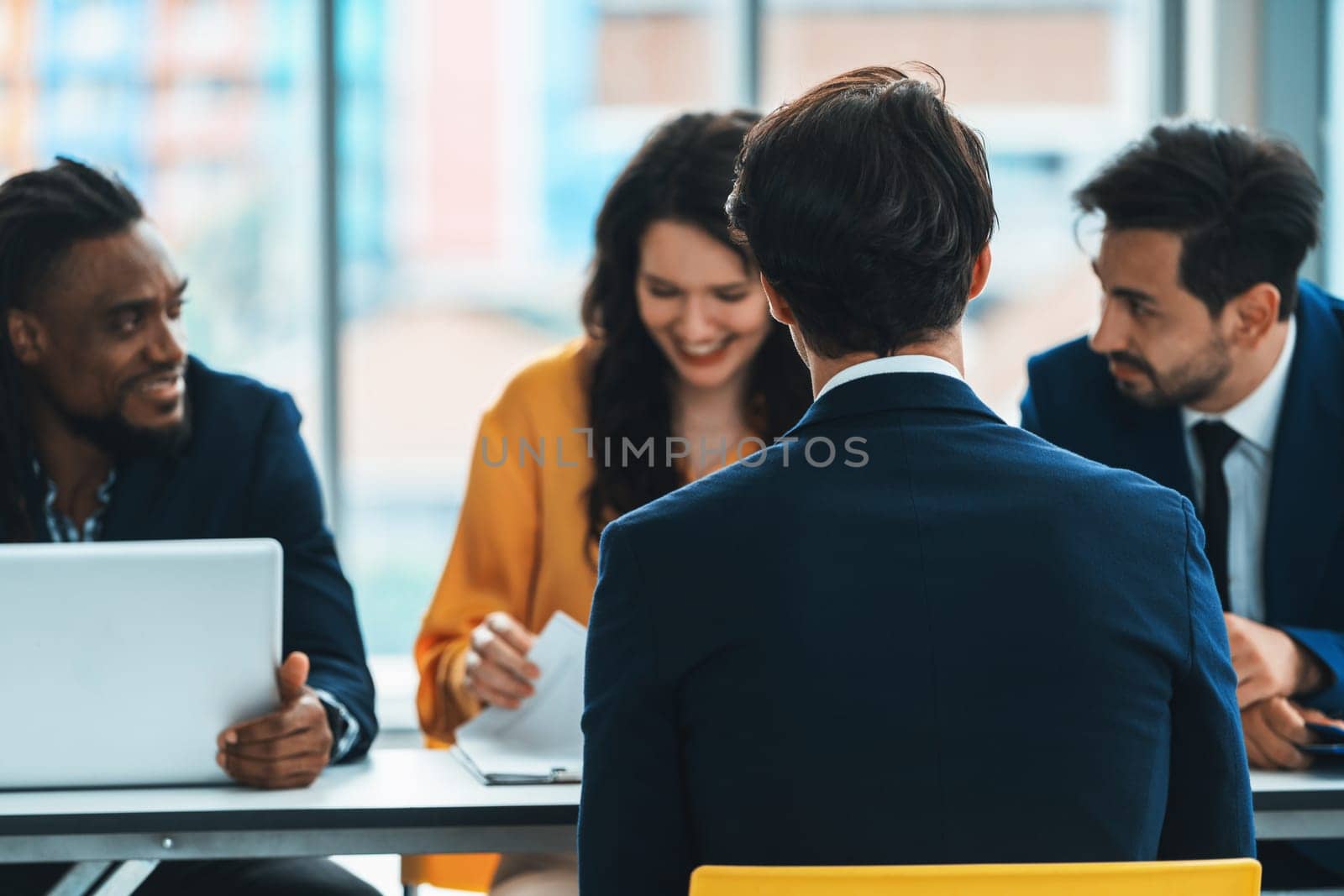 Diversity recruiters interview candidate at the bright office. A group of human resources professionals explaining an applicant for a new position. asking interviewee a question. Intellectual.