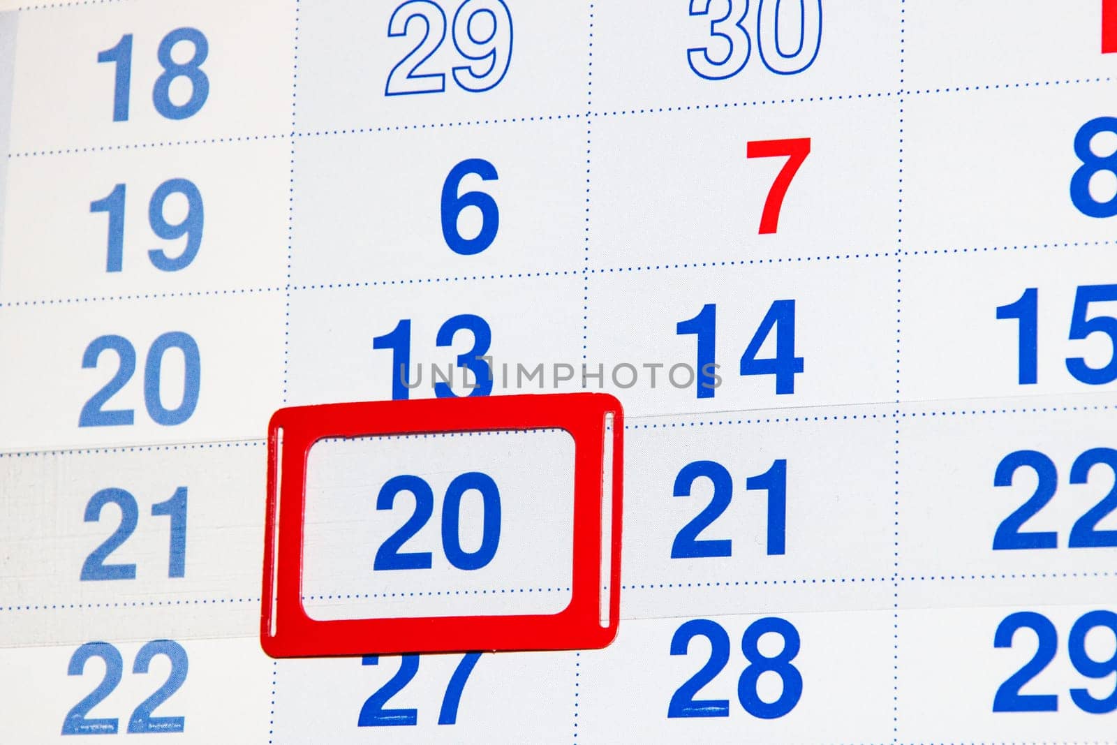 White calendar with a marked date twentieth close up