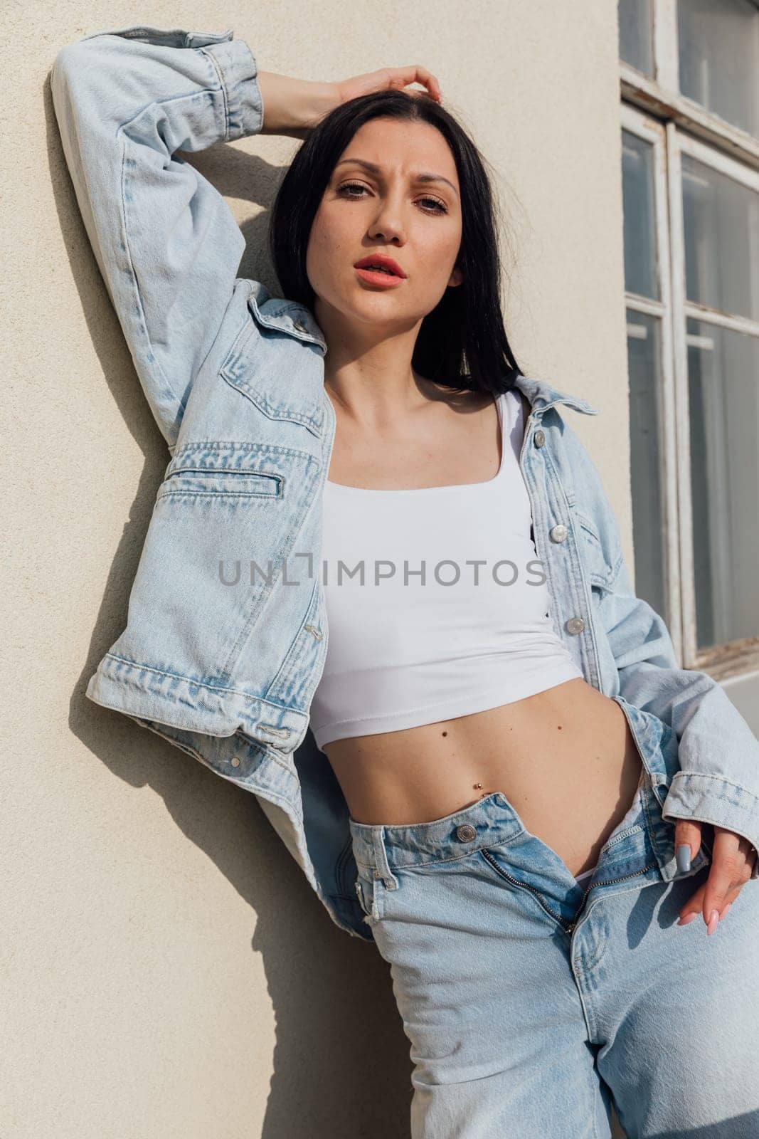 fashionable woman posing on balcony outdoors