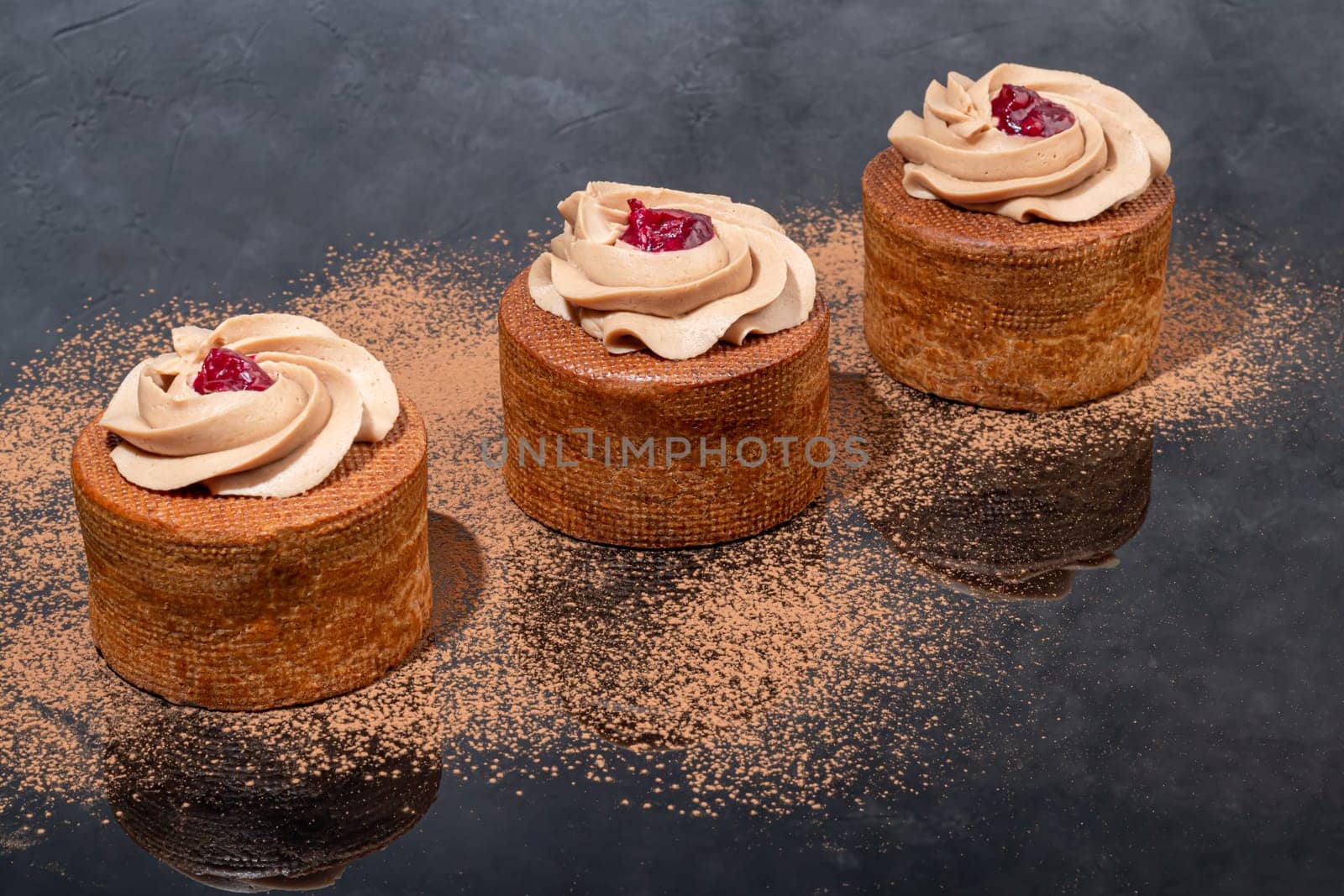 Cakes filled with cream and cherry jam. Box eclairs. New Year and holiday concept. Copy space