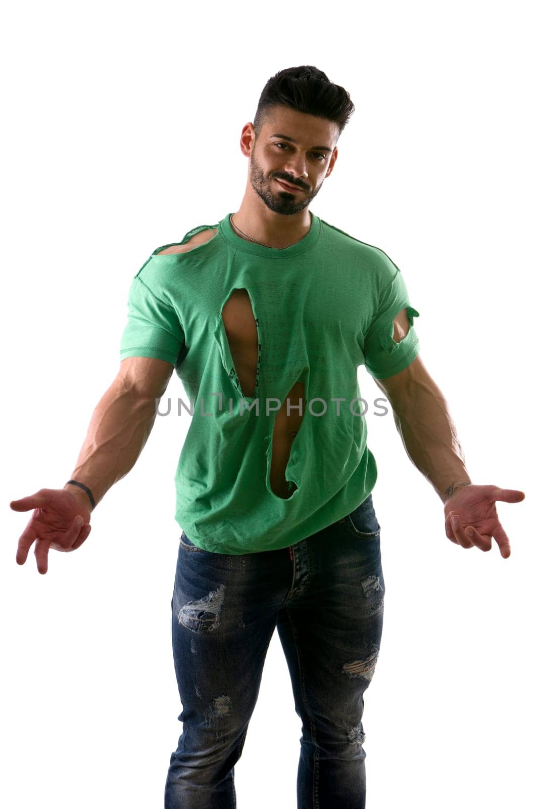 Handsome strong man in ripped t shirt on white by artofphoto