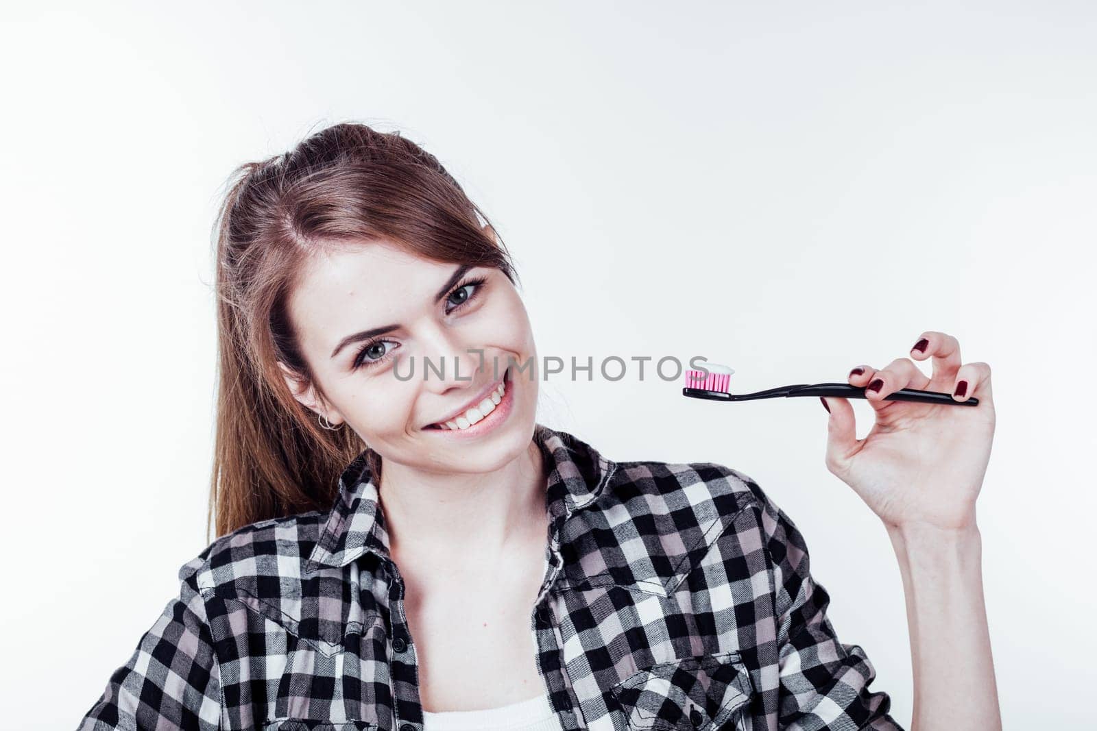 the girl smiles healthy teeth tooth brush by Simakov