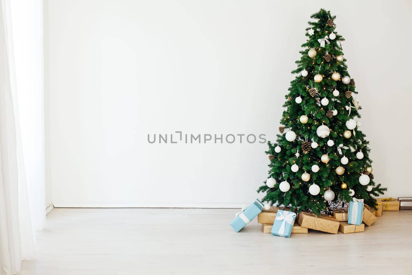 Christmas tree with gifts decor for the new year holiday winter interior by Simakov