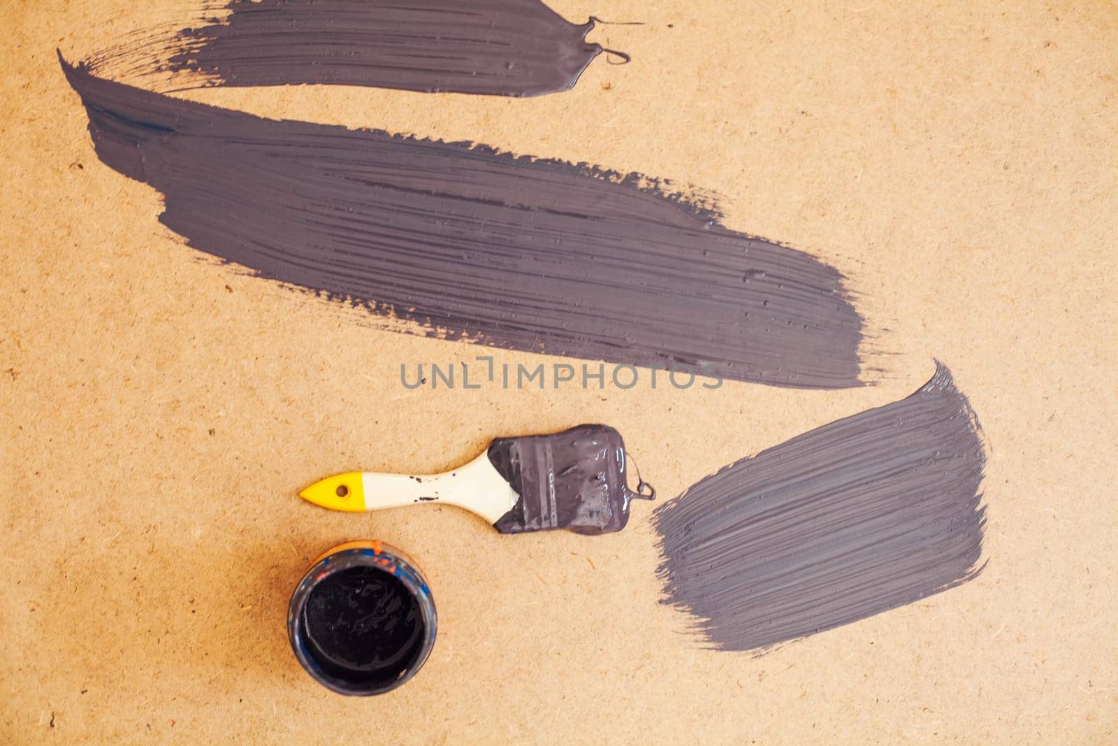 brush and smear paint on a brown texture background by Simakov