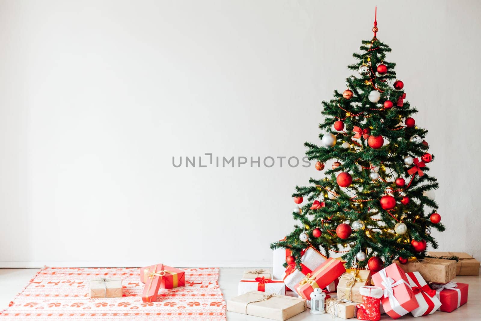Christmas tree with red decor gifts for the new year holiday winter by Simakov