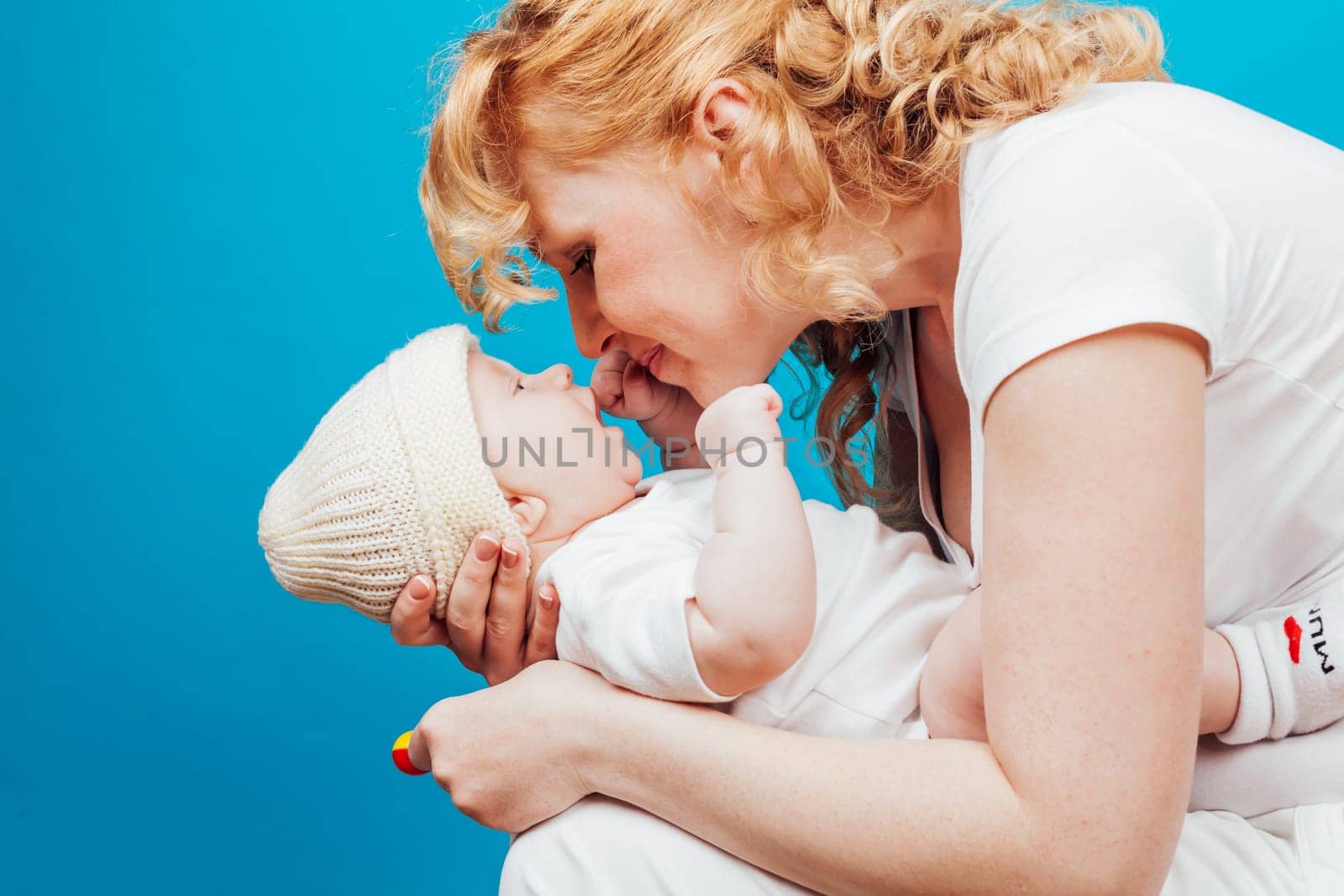 mom in white clothes with her son baby in love happiness