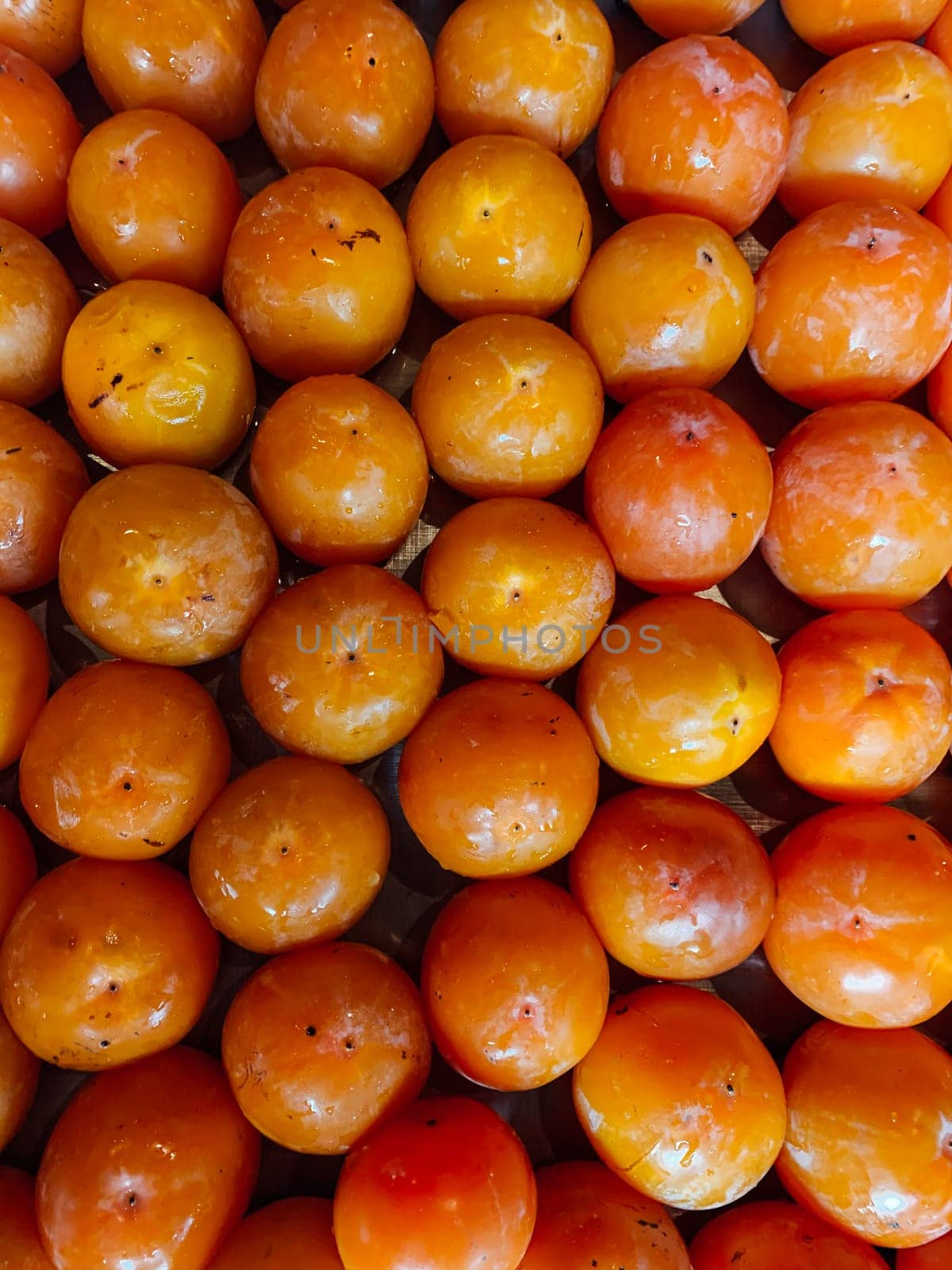 lots of ripe orange persimmon fruit food