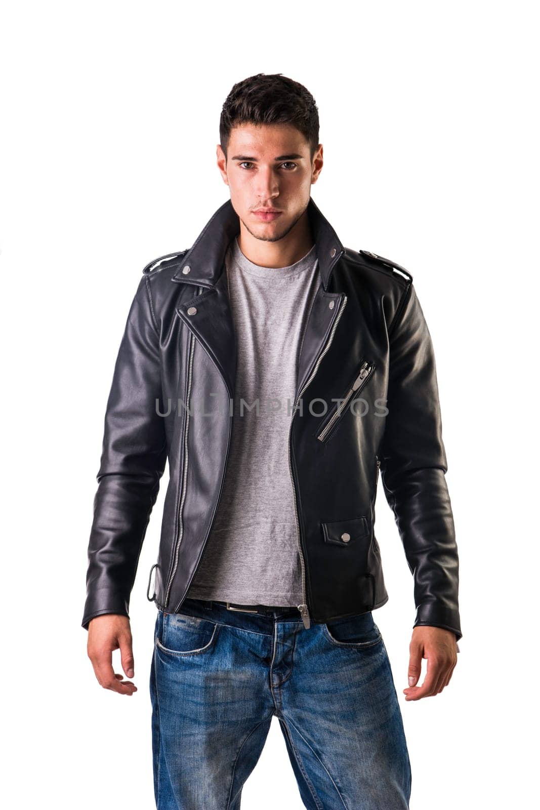 Young handsome man in studio shot, wearing black leather jacket by artofphoto