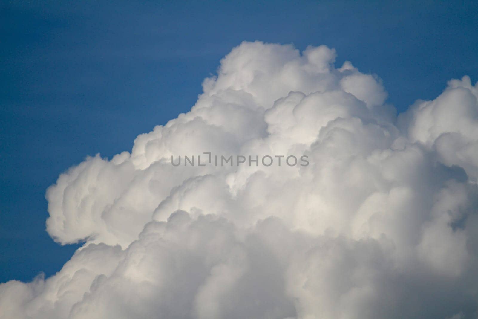 White fluffy big clouds against sky landscape