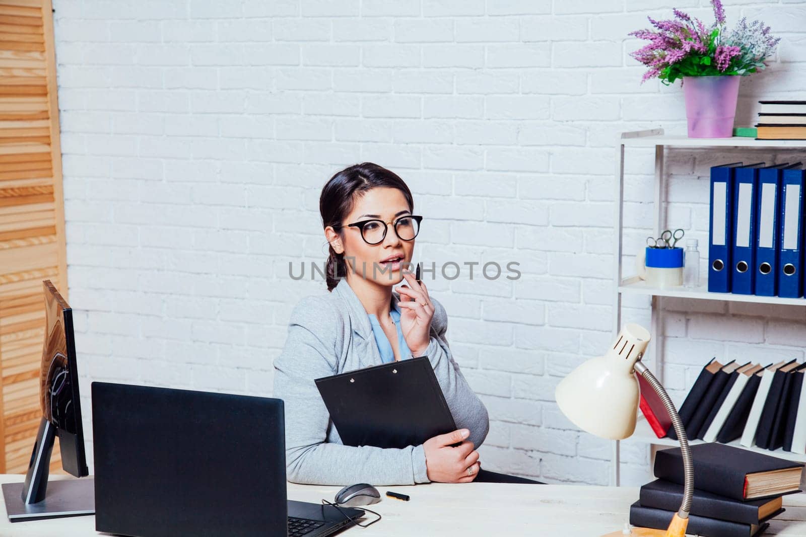 business woman in an Office works at the computer new