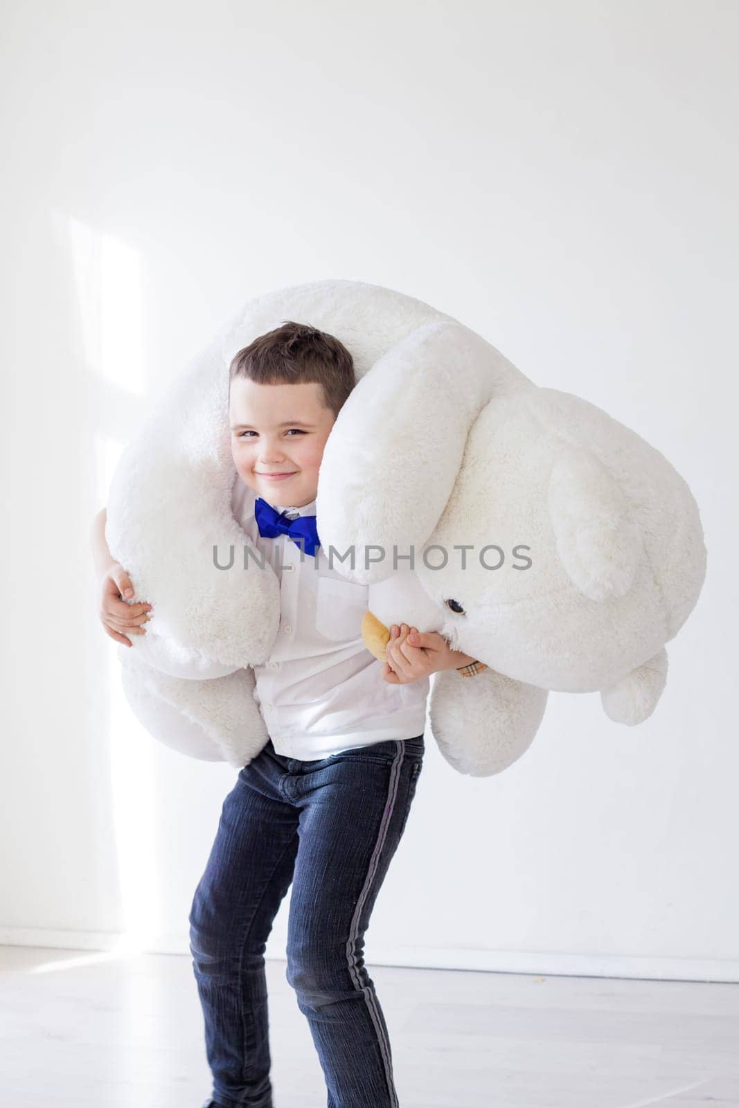 Boy with soft polar bear toy gift by Simakov