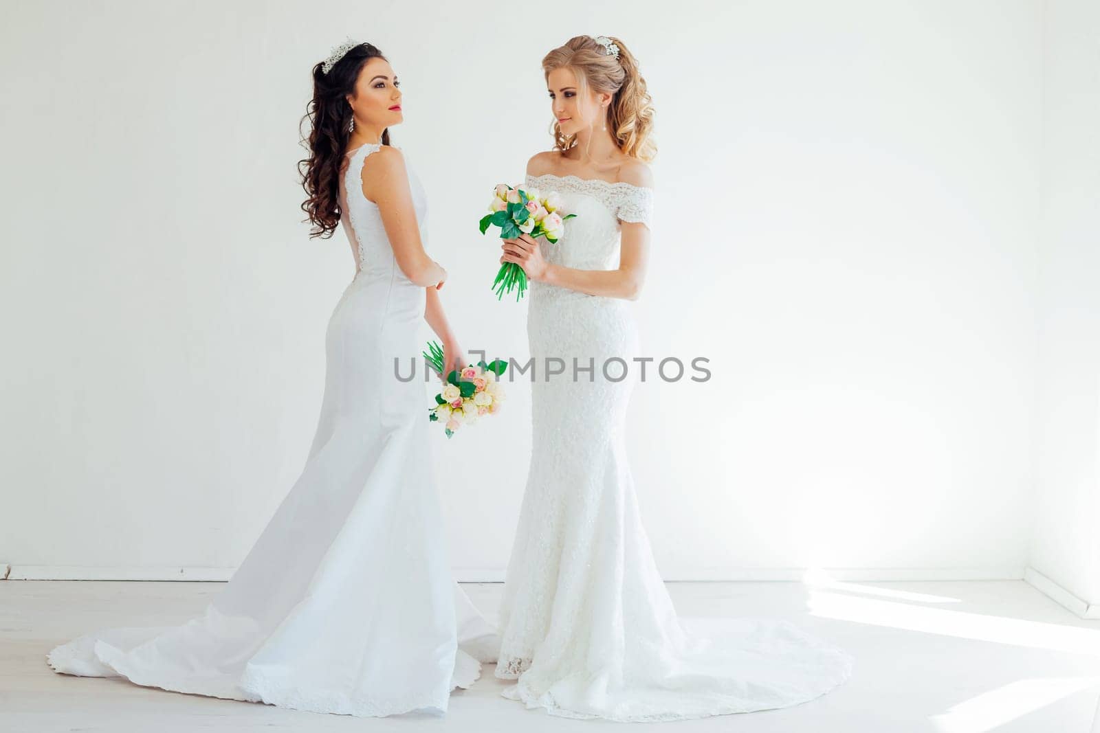 two wedding bride with bouquet wedding hairstyle