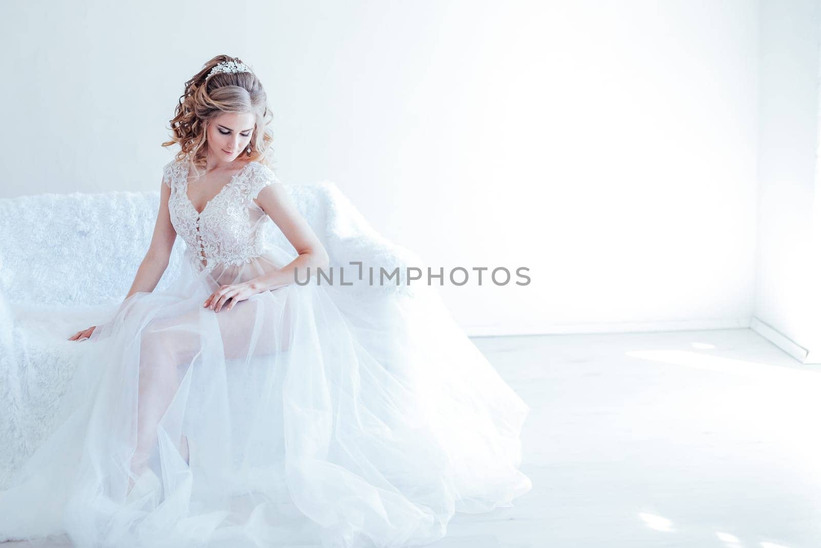 beautiful girl in lingerie sitting on a white couch wedding by Simakov
