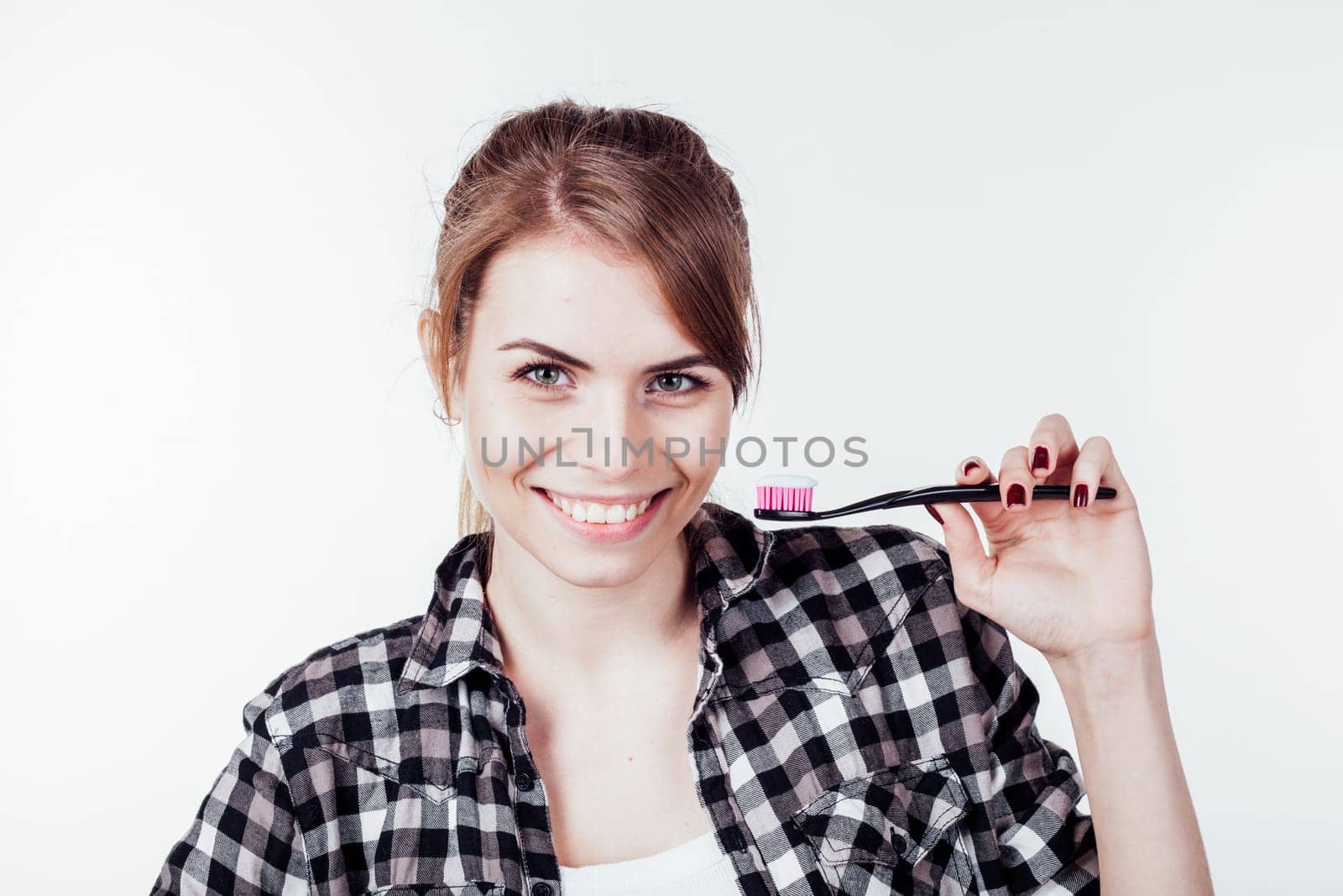 the girl smiles healthy teeth tooth brush 1