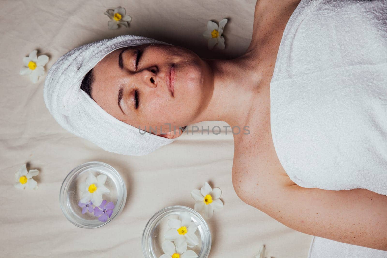 beautiful woman lies in the sauna spa relax massage