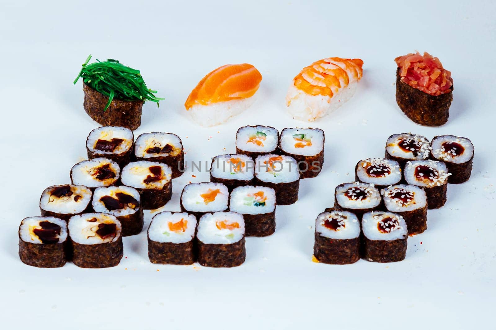Sushi rolls Japanese food restaurant fish figure on a white background by Simakov