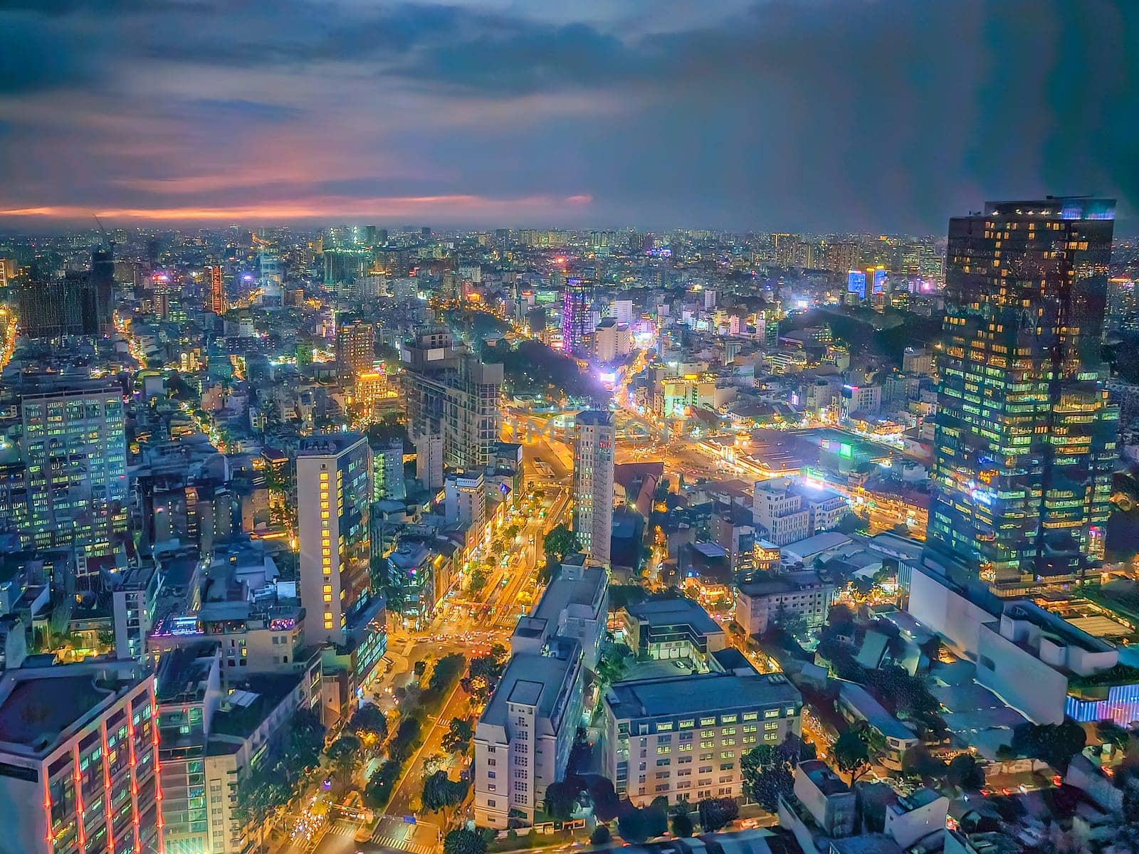 Beautiful Ho Chi Minh Saigon aerial view with buildings and river by sunset