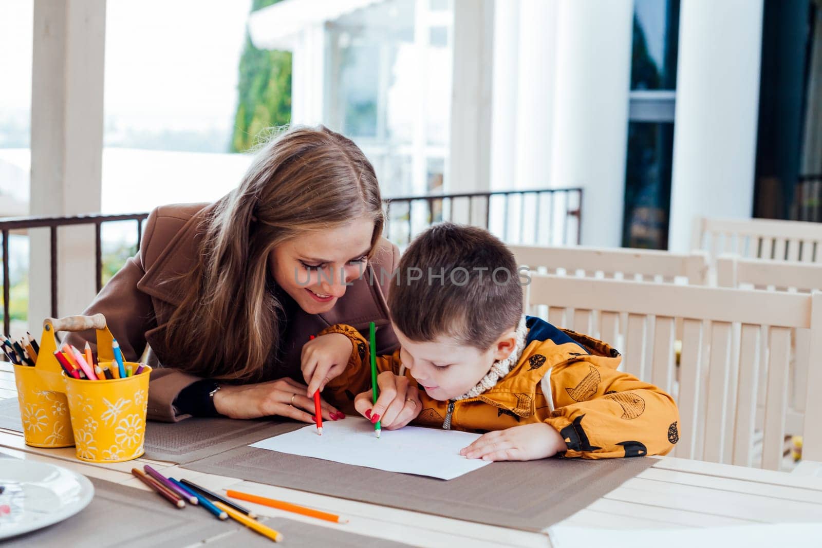 mother and son draw drawing hands colored pencils by Simakov