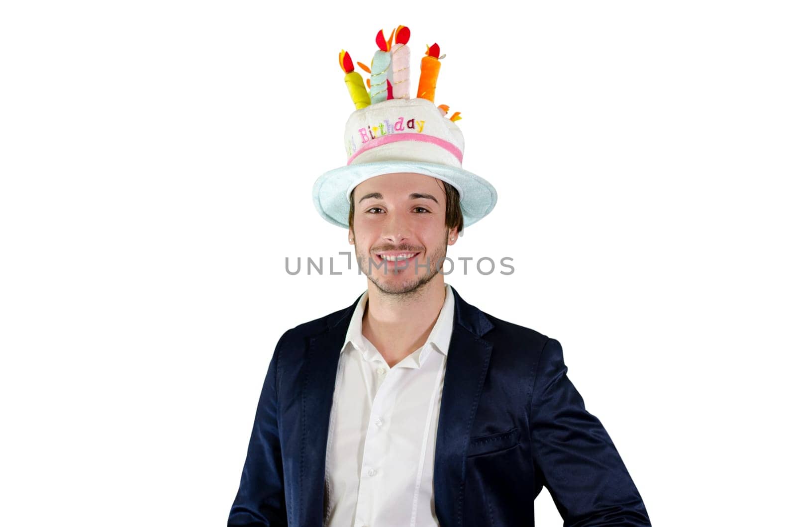 A man wearing a birthday hat with candles on it
