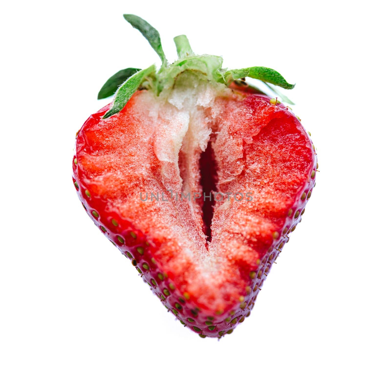 Ripe half of a strawberry on a white background. by sarymsakov