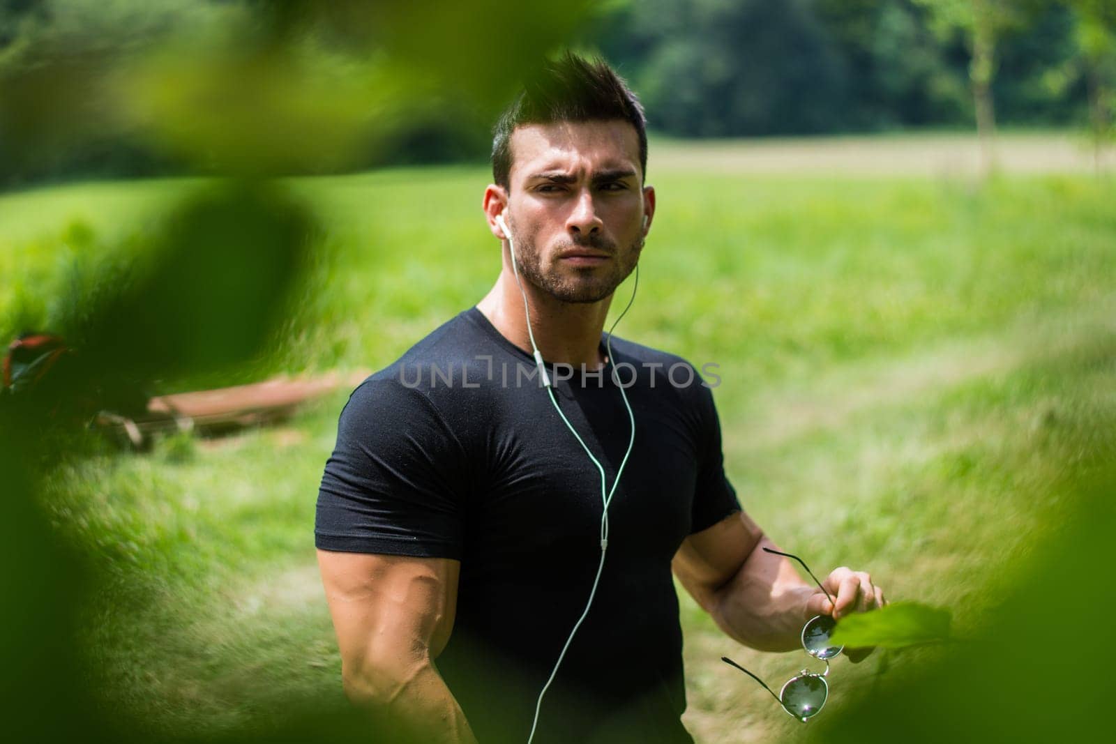 Man Holding Black Headphones by artofphoto