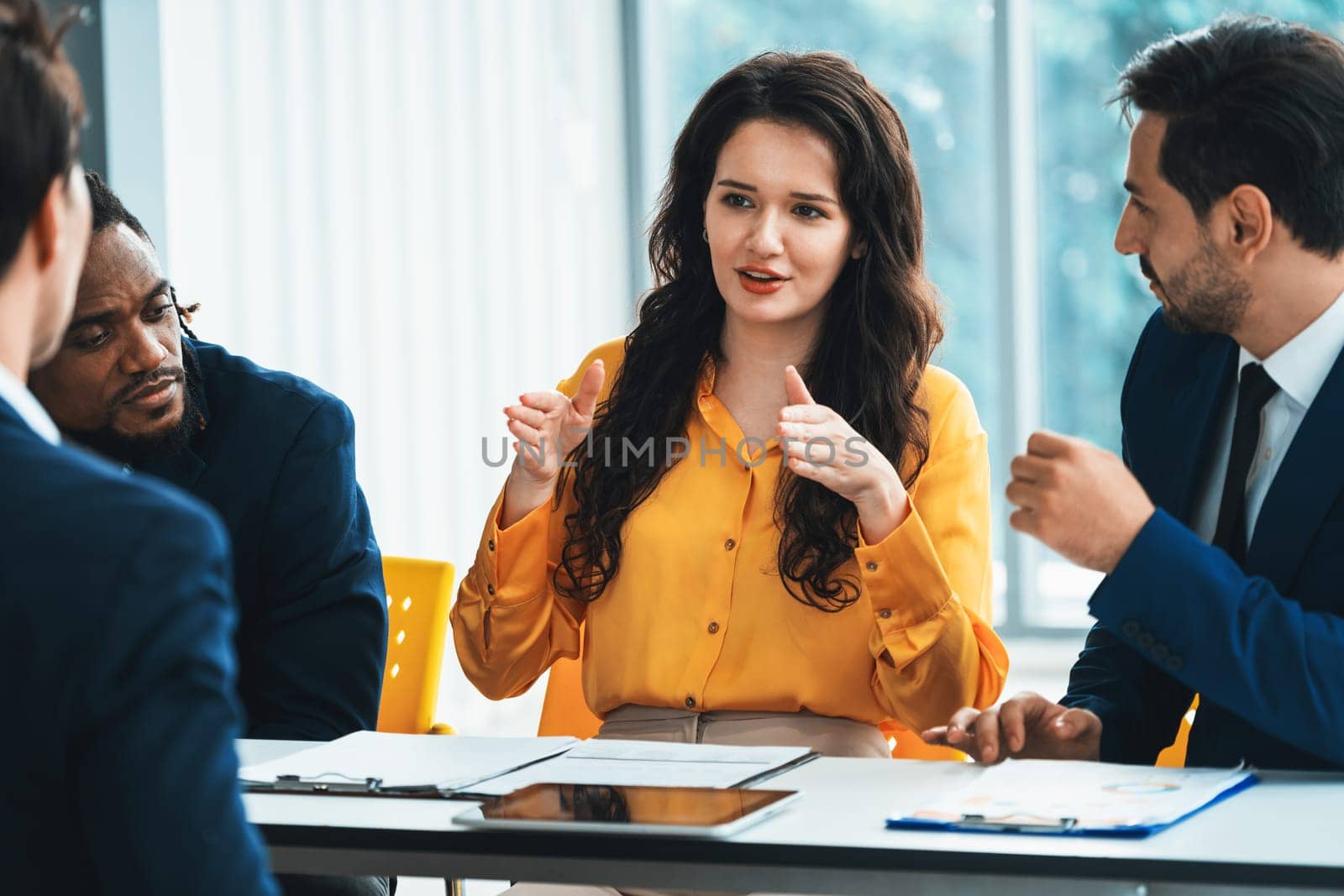 Diversity recruiters interview candidate at the bright office. A group of human resources professionals explaining an applicant for a new position. asking interviewee a question. Intellectual.