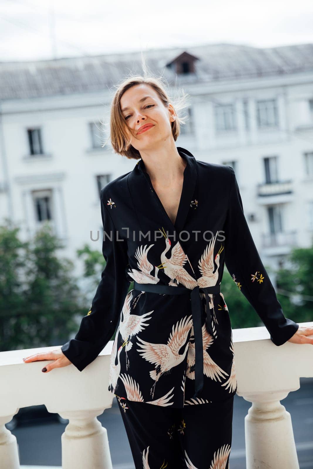 Portrait of a beautiful fashionable woman in a summer suit by Simakov