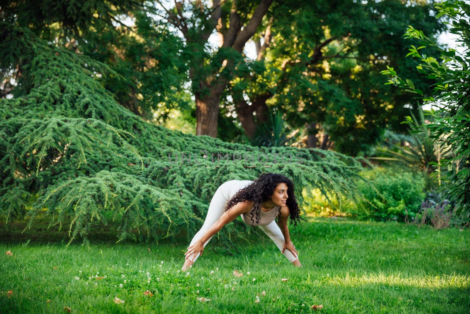 Woman doing yoga exercises asana breathing gymnastics balance