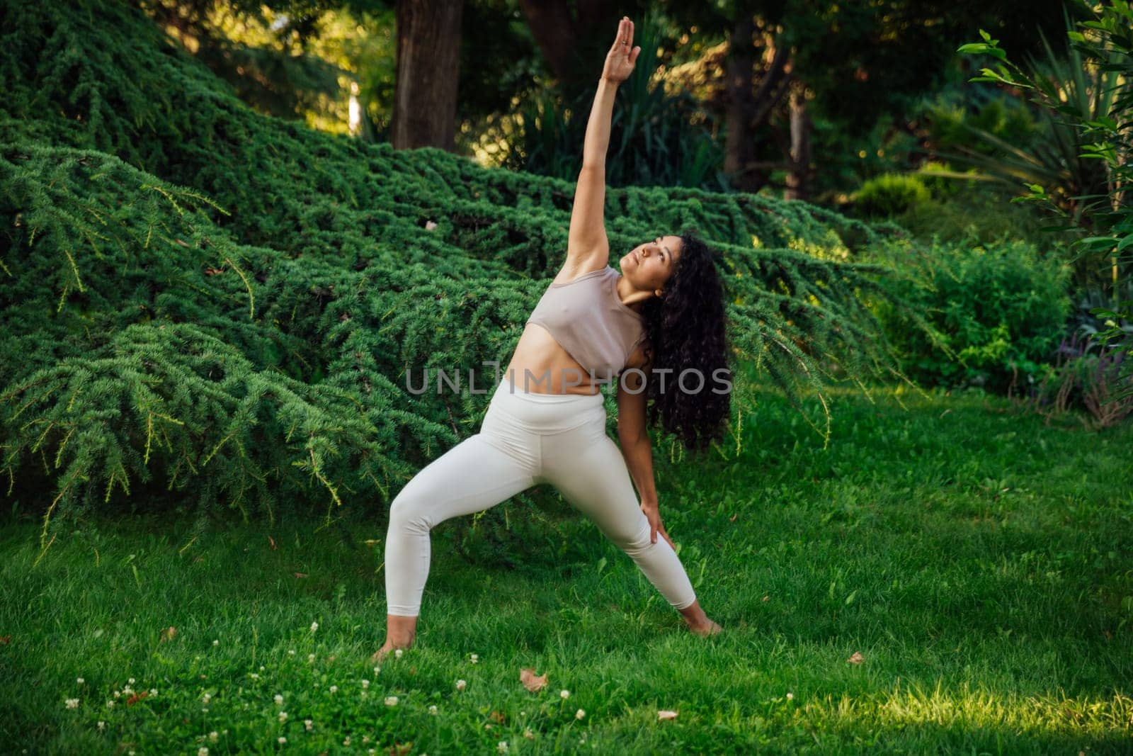Woman doing yoga exercises asana breathing gymnastics balance