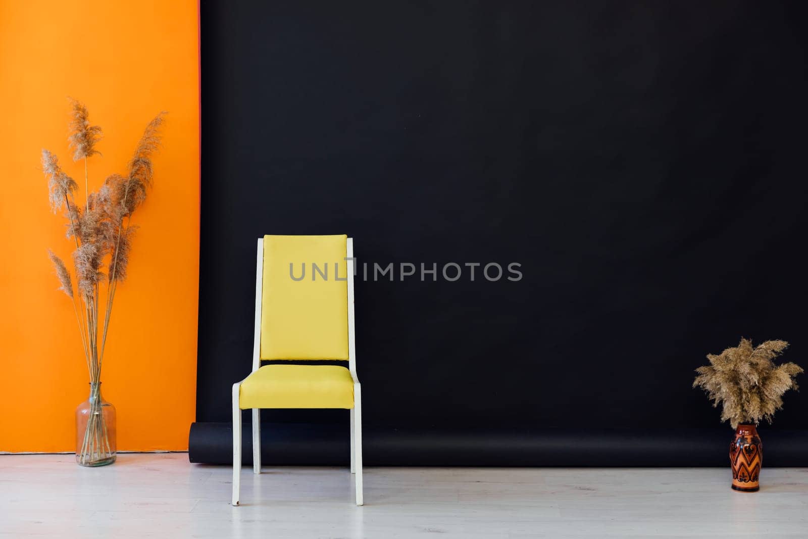 Yellow chair in black orange room interior by Simakov