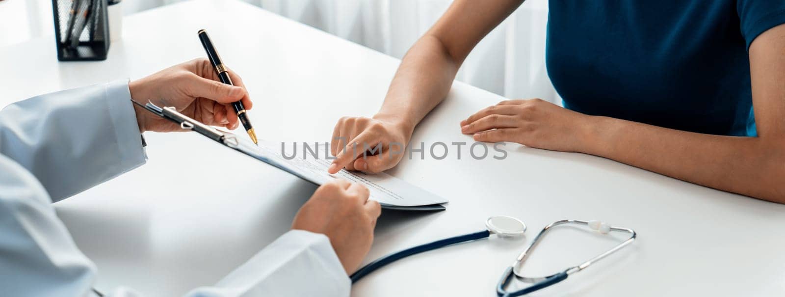 Patient attend doctor's appointment at clinic or hospital office, discussing medical treatment options and explaining examination results or medical record about sickness. Panorama Rigid