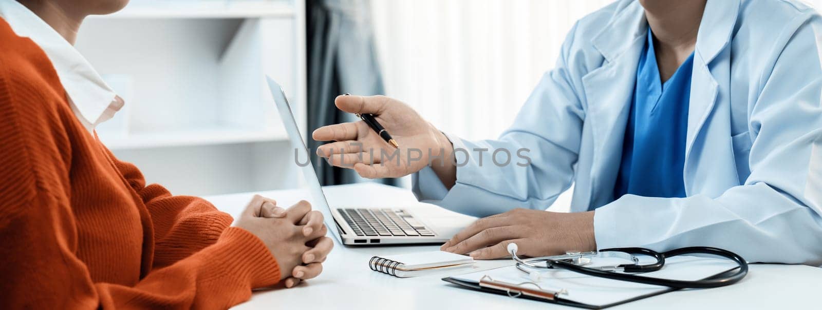 Laptop display medical report or diagnostic result of patient health on blurred background of doctor's appointment in hospital. Medical consultation and healthcare treatment. Panorama Rigid