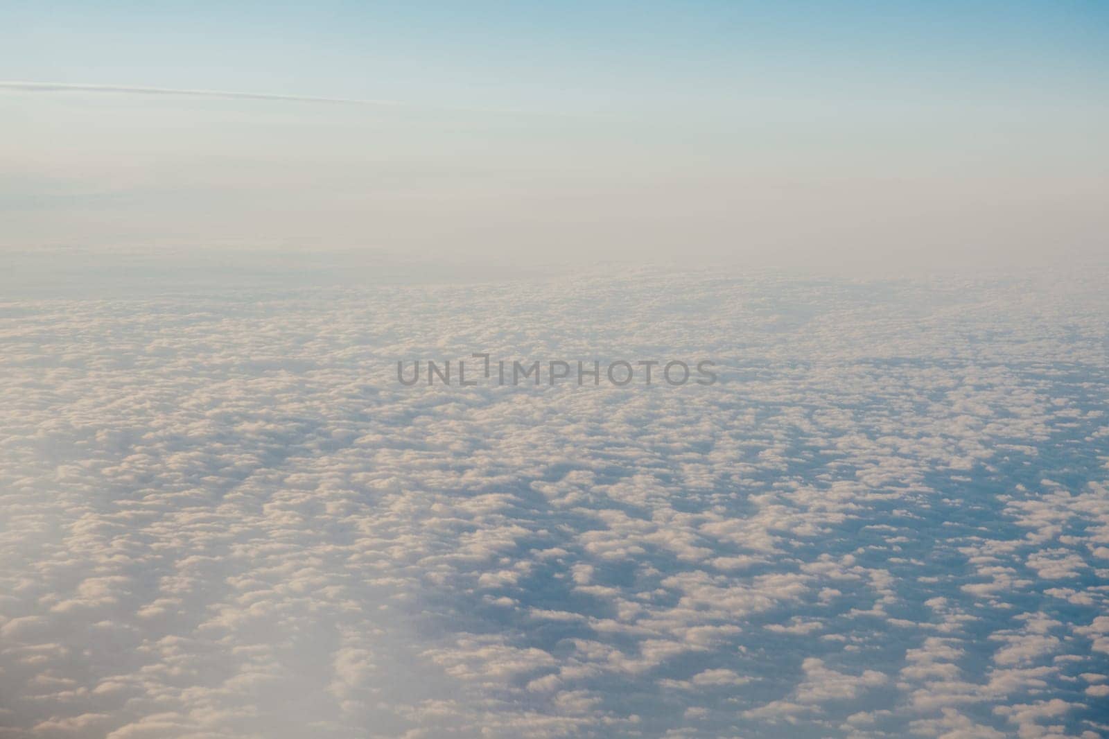 clouds at sunset from the plane in the sky landscape 1