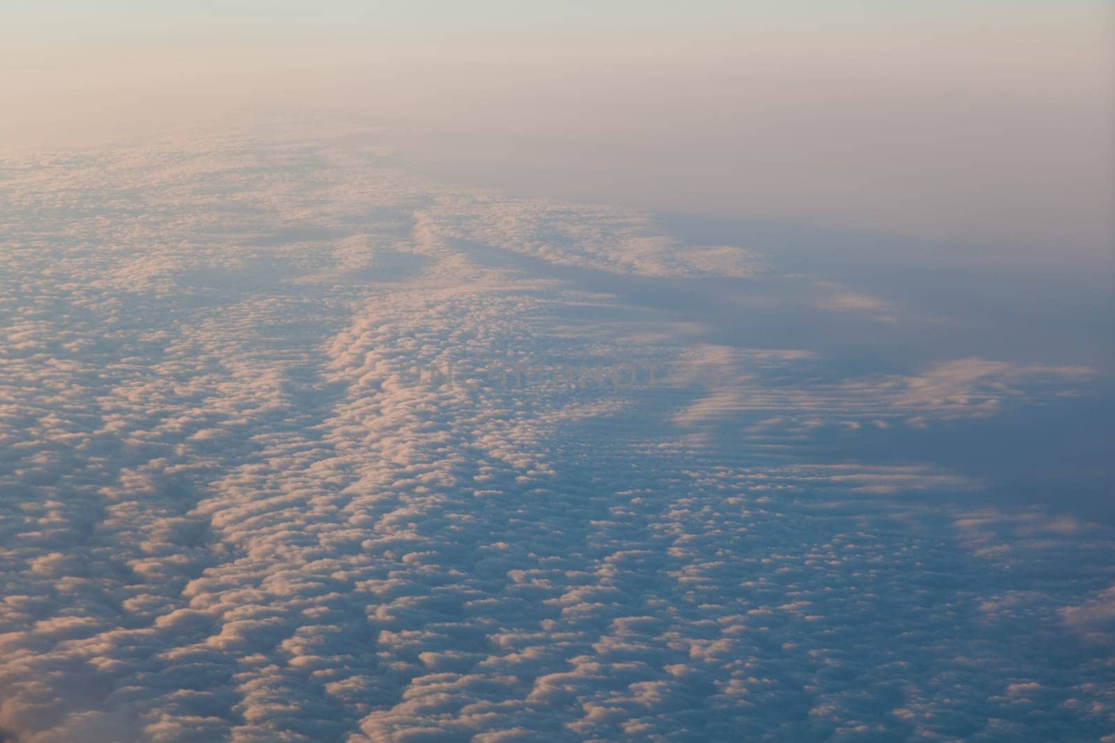 clouds at sunset from the plane in the sky landscape by Simakov