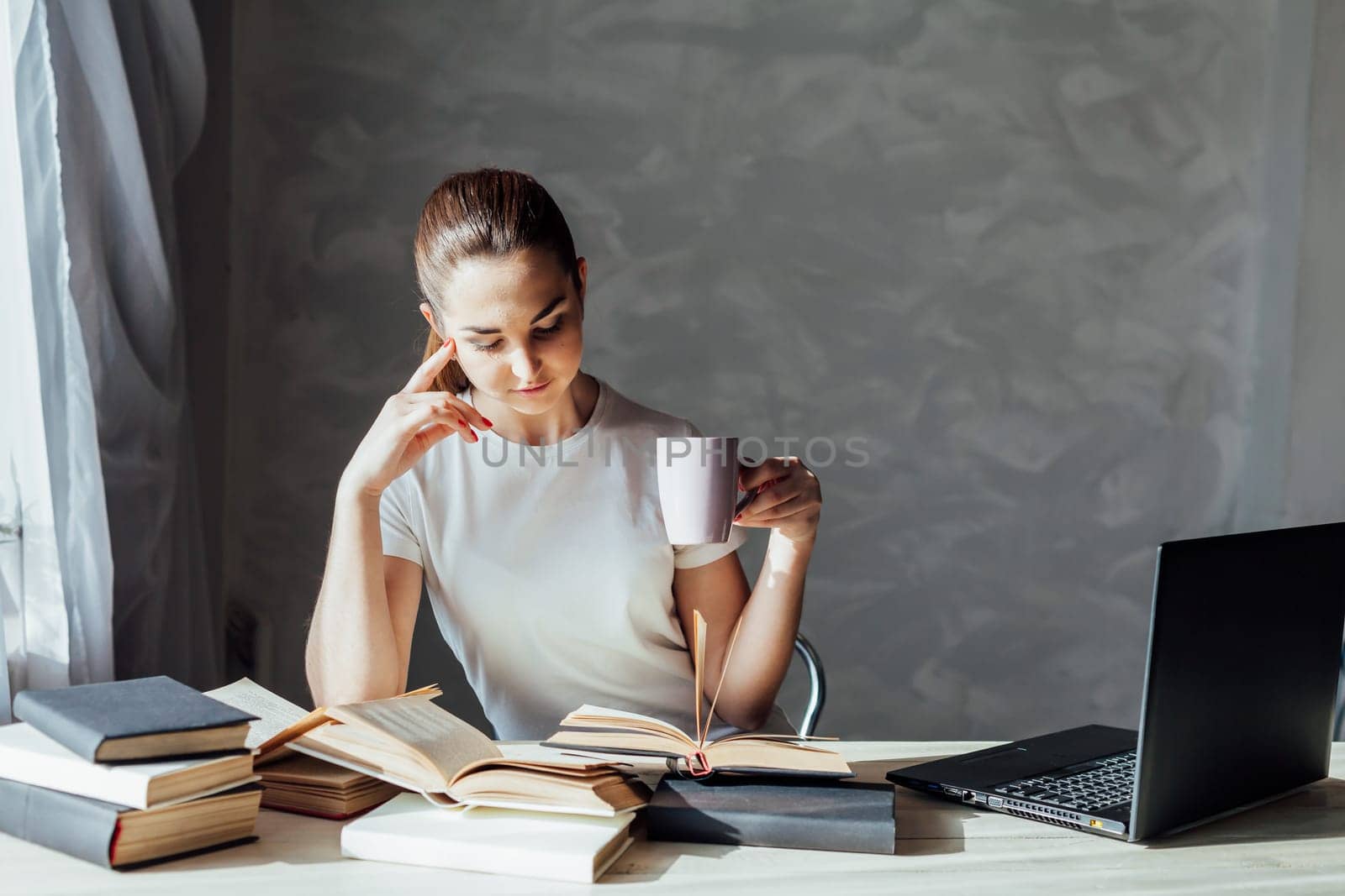 girl reading a book and drinking coffee by Simakov