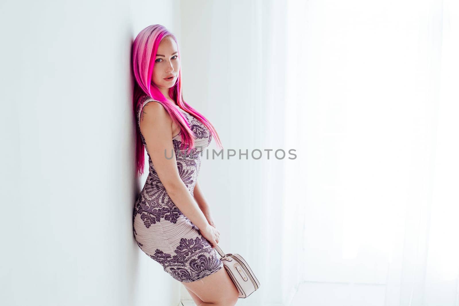 beautiful girl with pink hair posing at photoshoot 1