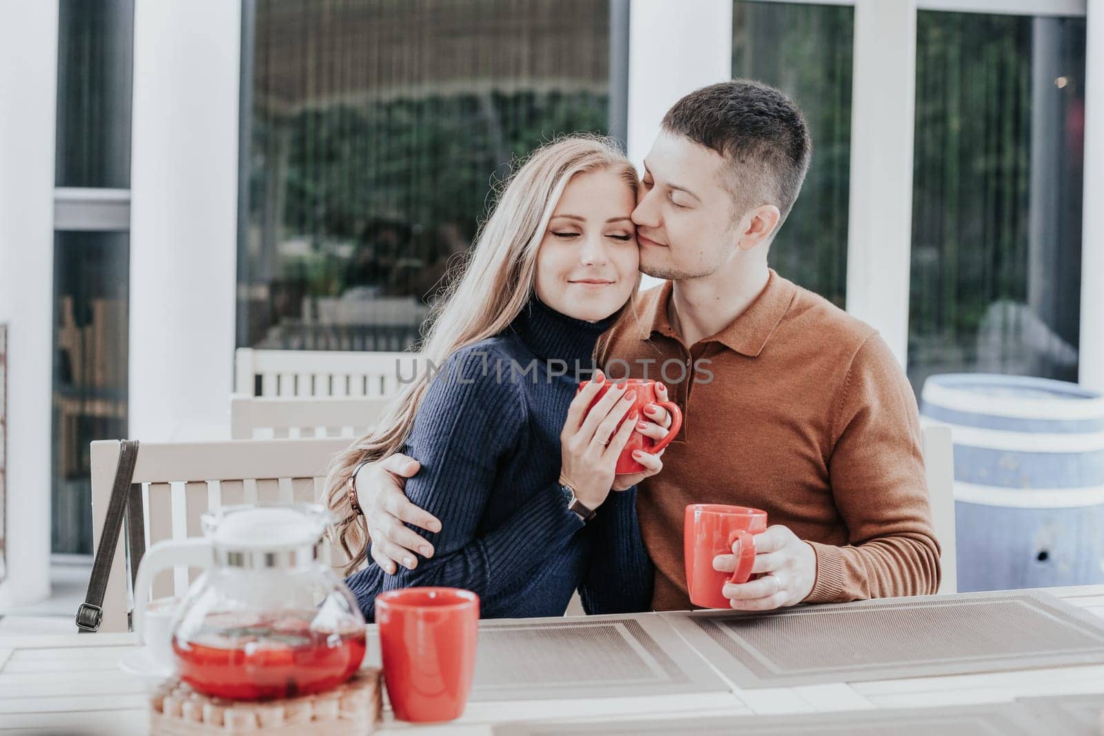husband and wife on holiday drink hot chocolate coffee tea 1